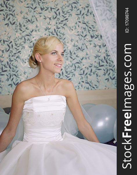 Portrait of a beautiful smiling bride on a sofa. Portrait of a beautiful smiling bride on a sofa