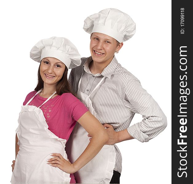 Young loving couple cooks. Over white background