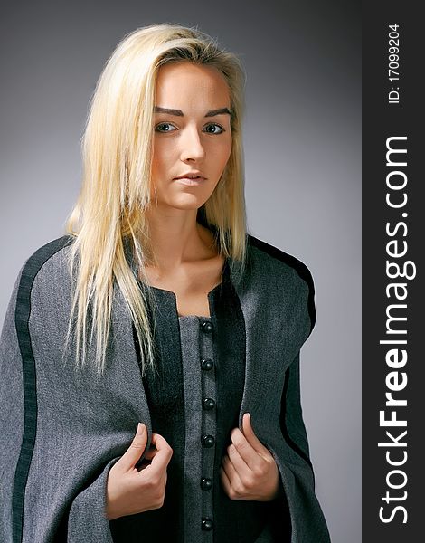 Beautiful model posing on grey background