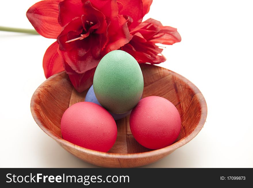 Easter-egg in wood bowl and flower. Easter-egg in wood bowl and flower