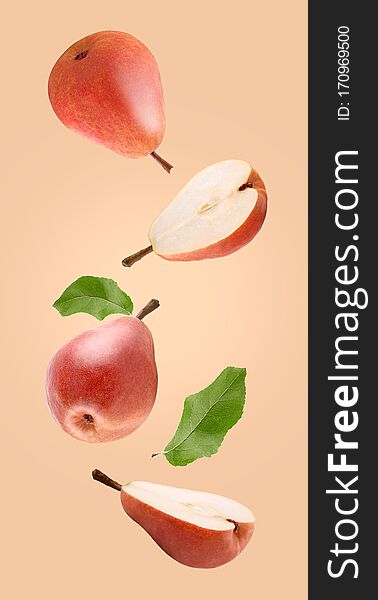 Flying fruit. Falling red Williams pear with leaves with clipping path as package design element and advertising. Full depth of field. Flying fruit. Falling red Williams pear with leaves with clipping path as package design element and advertising. Full depth of field