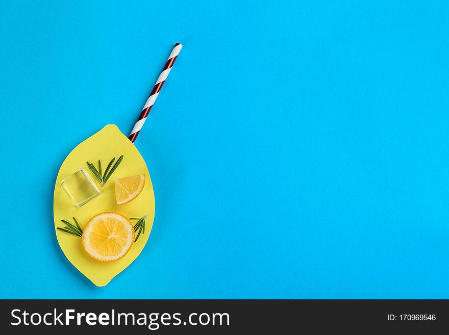 Creative Lemonade Layout With Lemon Slices On Blue Background, Top View. Space For Text