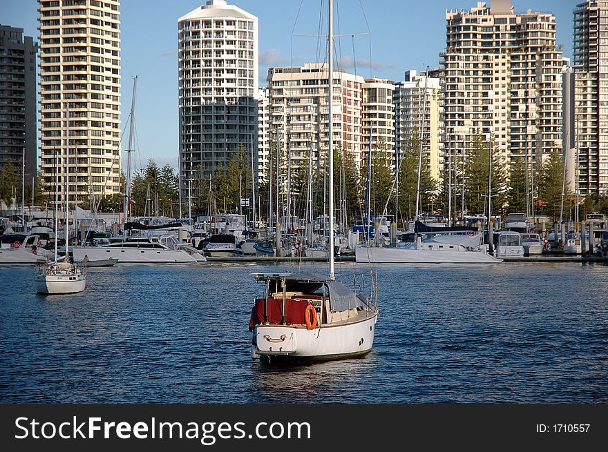 Boats and Yachts againtst apartments background in Main Beach,Gold Coast, Australia. Boats and Yachts againtst apartments background in Main Beach,Gold Coast, Australia.