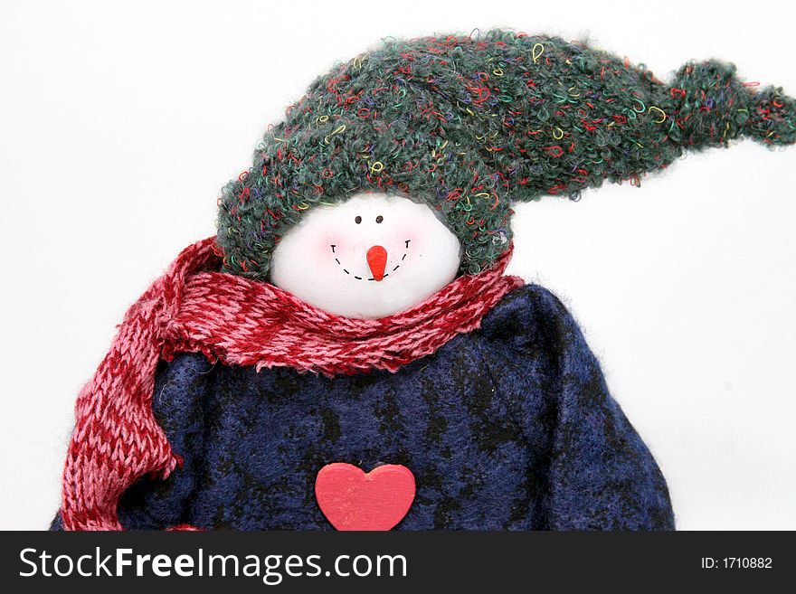 Smiling snowman with a stocking cap and blue sweater and red scarf. Smiling snowman with a stocking cap and blue sweater and red scarf