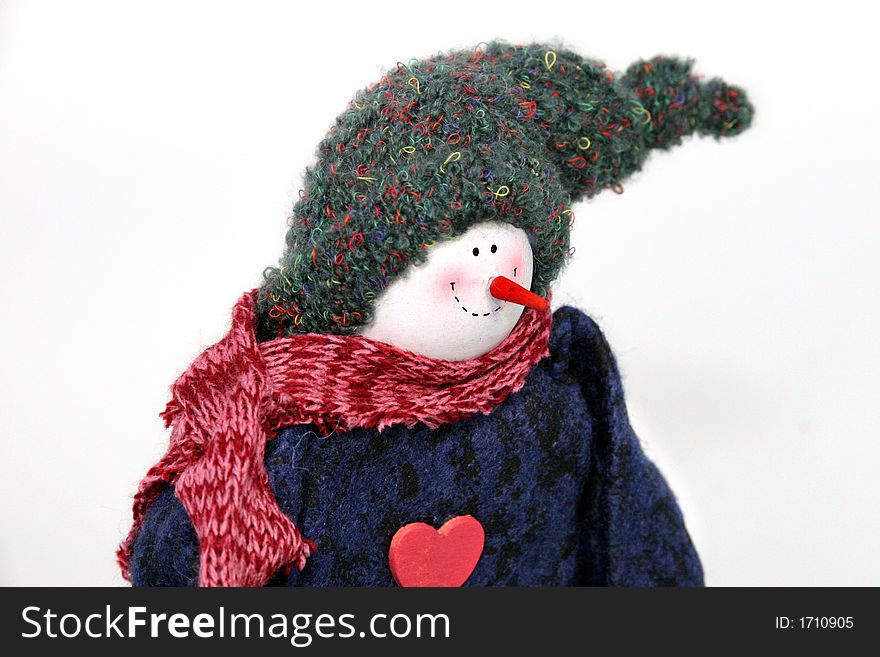 Smiling snowman with a stocking cap and blue sweater and red scarf. Smiling snowman with a stocking cap and blue sweater and red scarf
