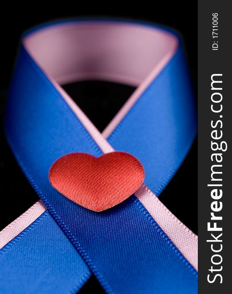 Pink and Blue ribbons with red silk heart. Pink and Blue ribbons with red silk heart.