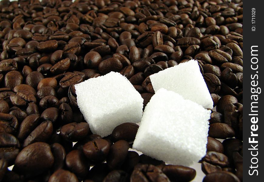 Close-up of coffee beans  with sugar. Close-up of coffee beans  with sugar