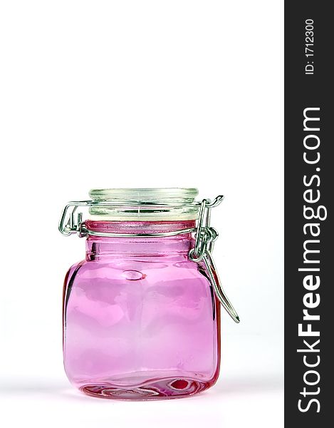 Closed pink jar isolated on white background