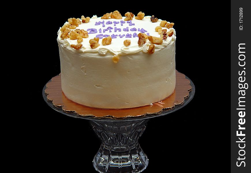 Tasty birthday cake with white frosting and nuts. (Carrot Cake). Tasty birthday cake with white frosting and nuts. (Carrot Cake)