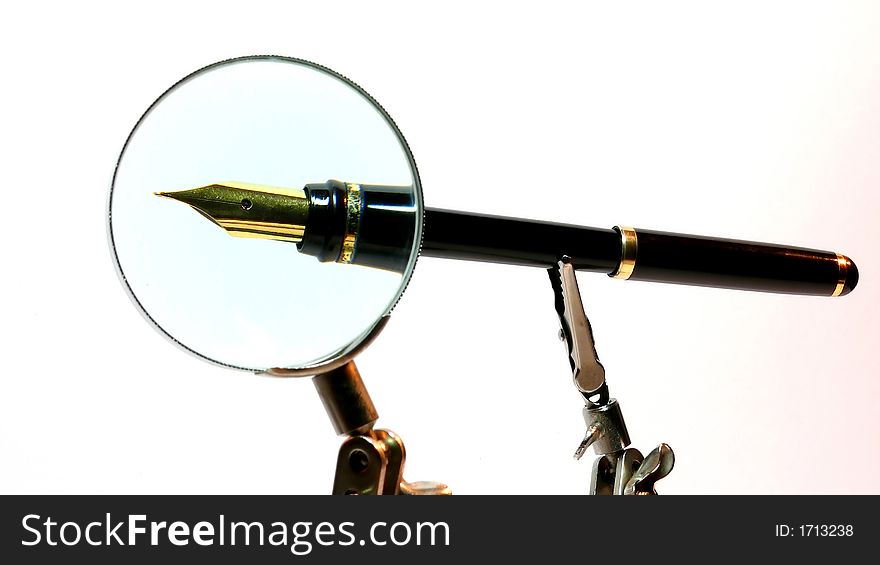 Look on a pen through the magnifying glass. Look on a pen through the magnifying glass