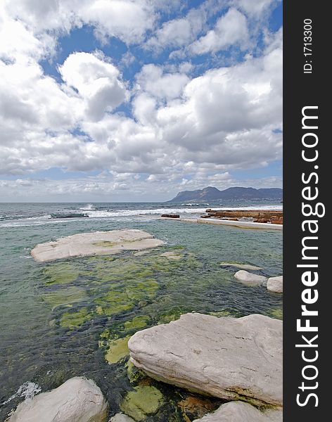 Rockpool With Cloudscape