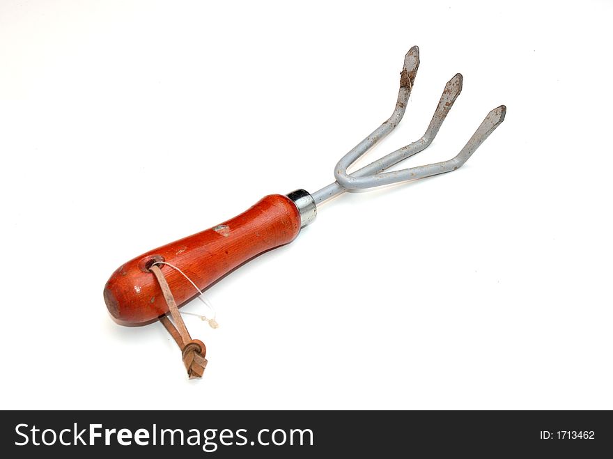 a small garden tool over a white background