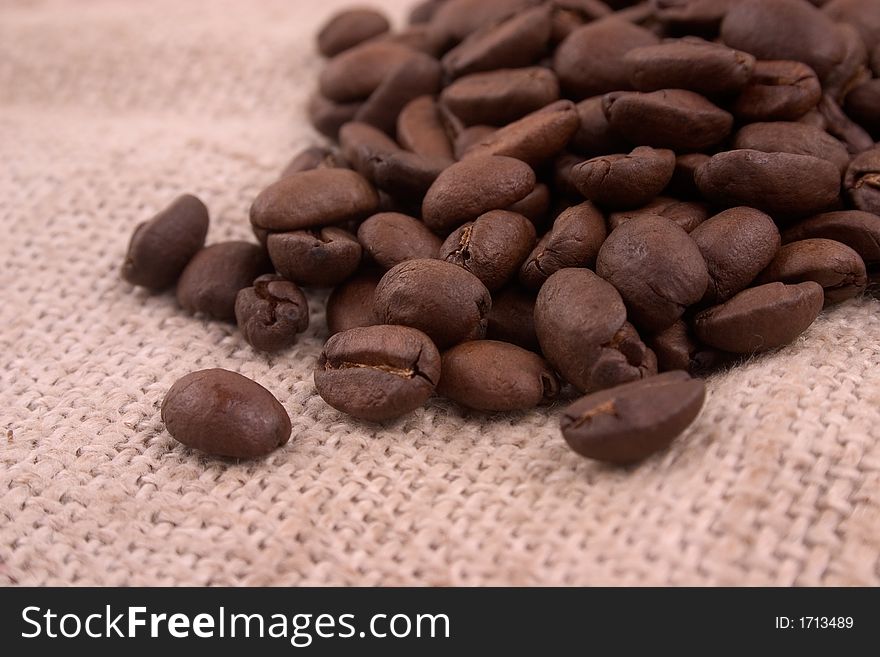 Closeup of coffee beans on linen background