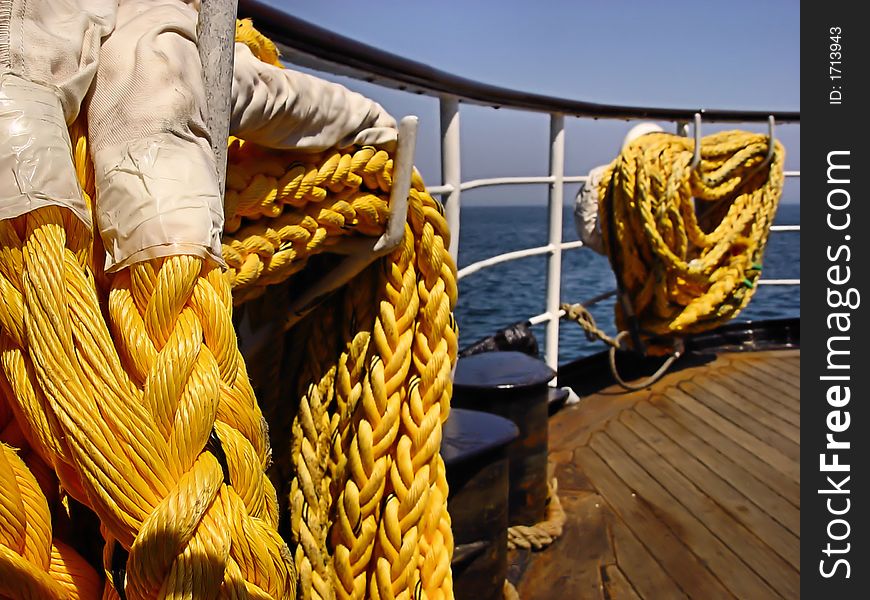 Closeup of a yellow rope on a boat. Closeup of a yellow rope on a boat