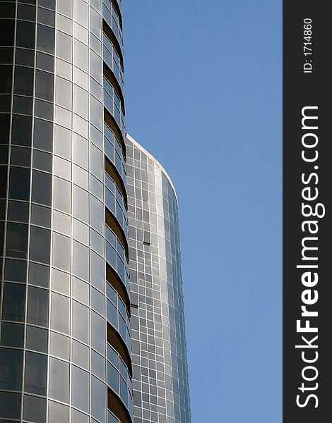 Modern skyscrapers against a bright blue sky