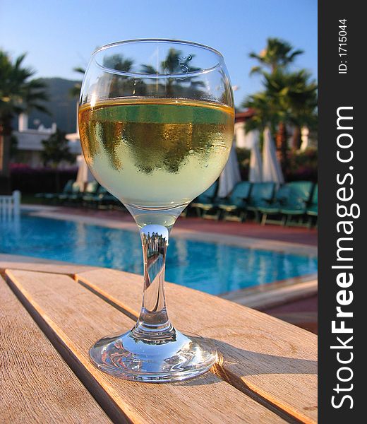 Goblet with wine on wood table. Goblet with wine on wood table