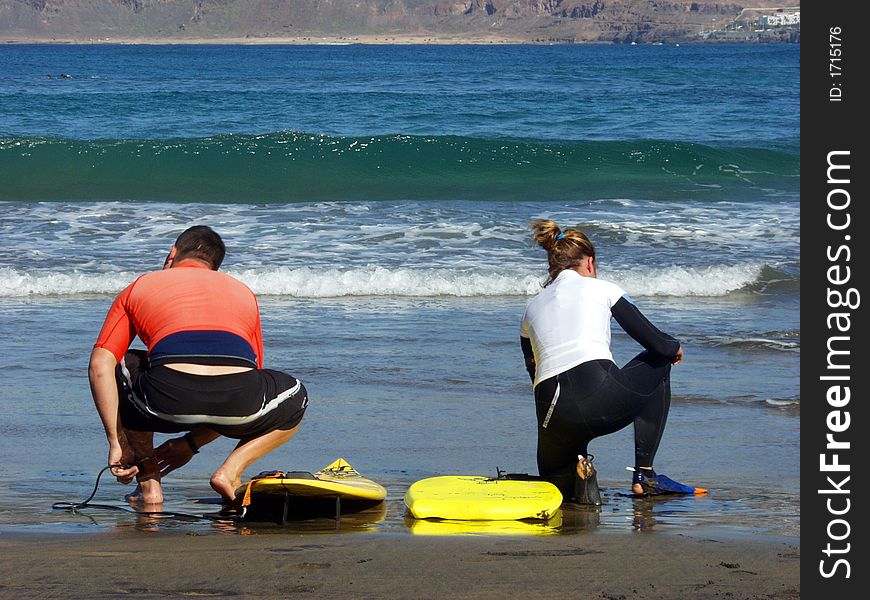 Two young surfers preparing for ride in the weaves