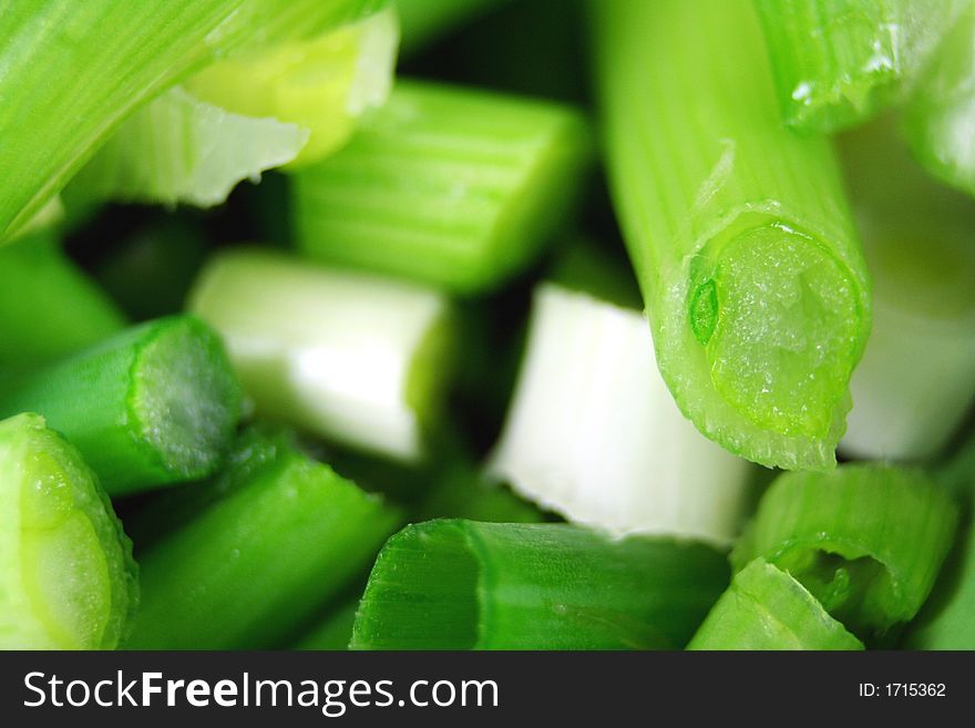 A pile of fresh diced green onions. A pile of fresh diced green onions