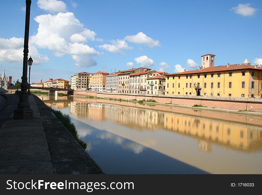 This picture shows typical italian architecture, which is mirrored in the river. This Picture was taken in Pisa, Italy in September 2005. This picture shows typical italian architecture, which is mirrored in the river. This Picture was taken in Pisa, Italy in September 2005