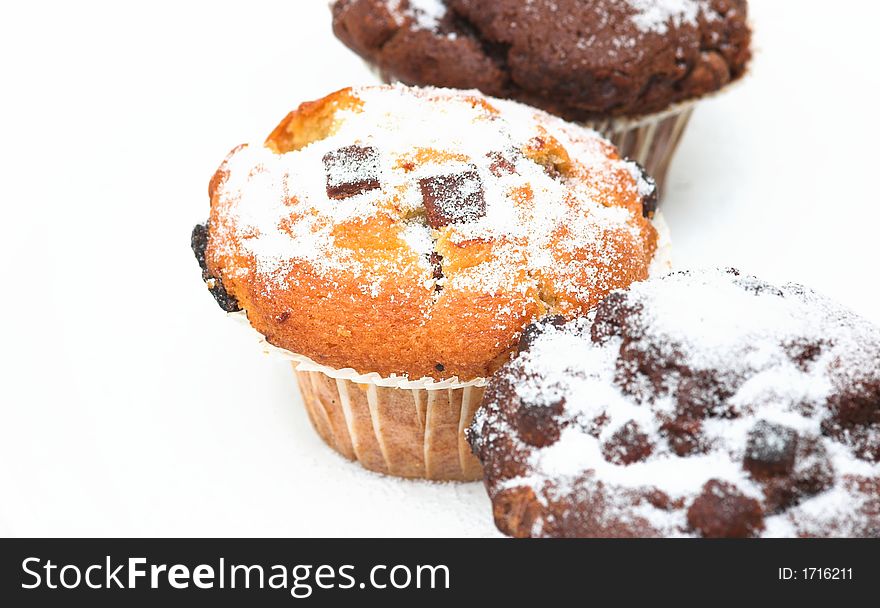 Chocolate muffins against a white background