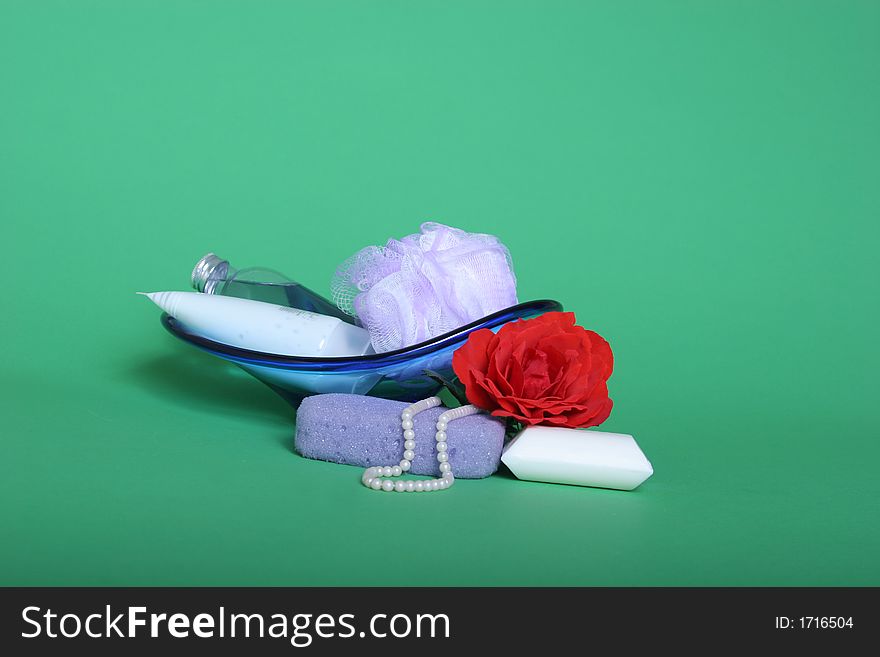 Bath items and red rose on green chroma key background. Bath items and red rose on green chroma key background