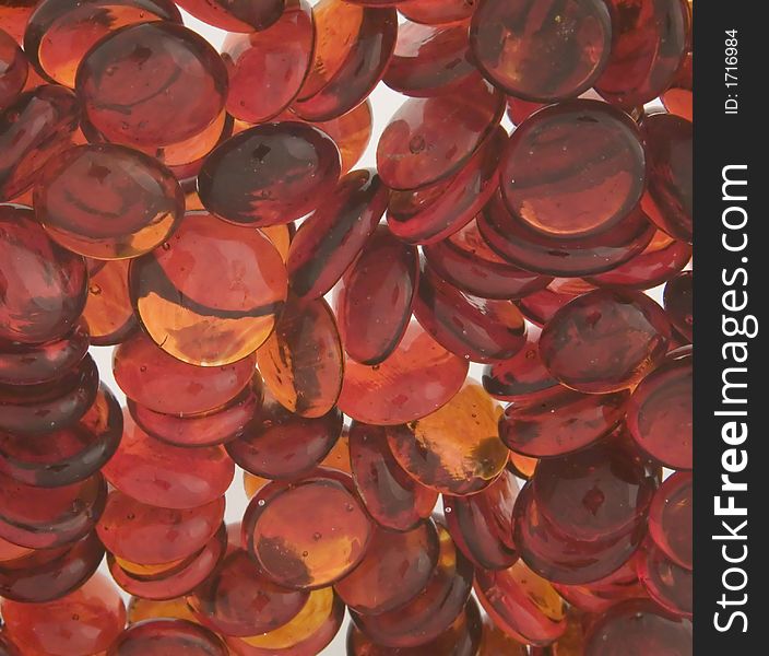 A lighted collection of red and orange stones. A lighted collection of red and orange stones