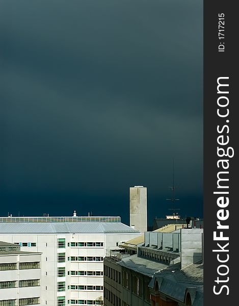 Industrial buildings with black stormy sky