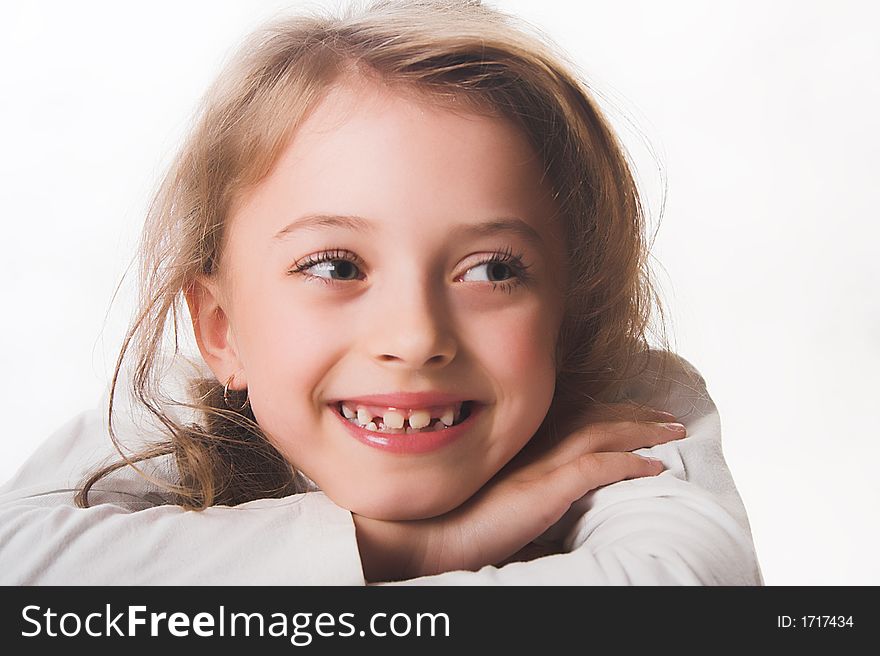 A Beautiful Blue-eyed, Blond Child Dressed In White.