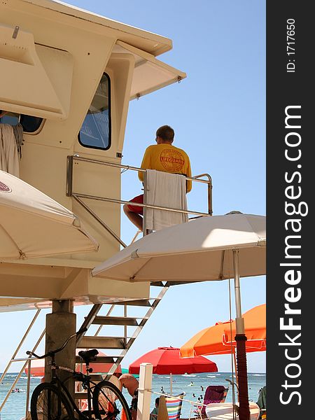 Lifeguard in duty watching out to the ocean