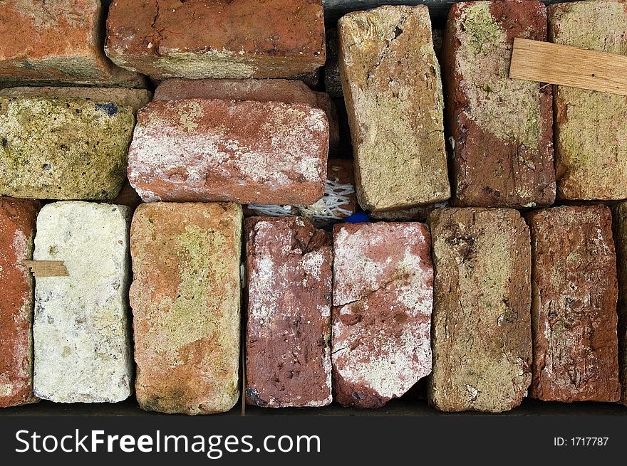 Different colors of bricks on the ground. Different colors of bricks on the ground