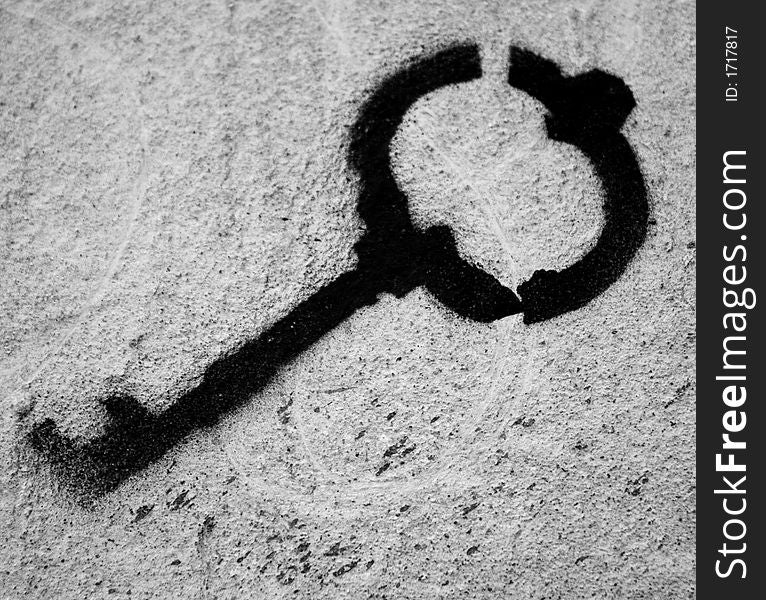 This is black paint image of key on the wall
