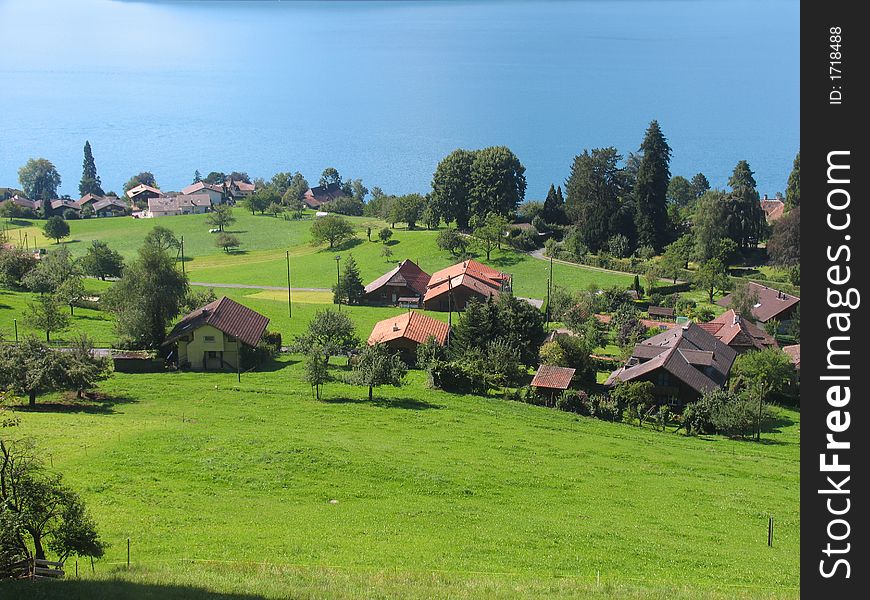 View of the Thun lake with cottages. View of the Thun lake with cottages