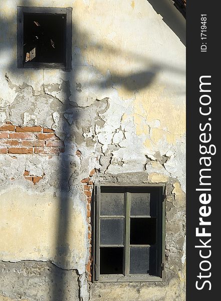 Street lantern shadow on the ruined house wall. Street lantern shadow on the ruined house wall