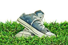 Old, Dirty Sneakers Over Spring Green Grass Royalty Free Stock Photo Old, Dirty Sneakers Over Spring Green Grass Royalty Free Stock Photo