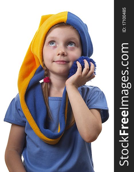 Little girl in the yellow-blue gnome cap isolated over white background. Little girl in the yellow-blue gnome cap isolated over white background