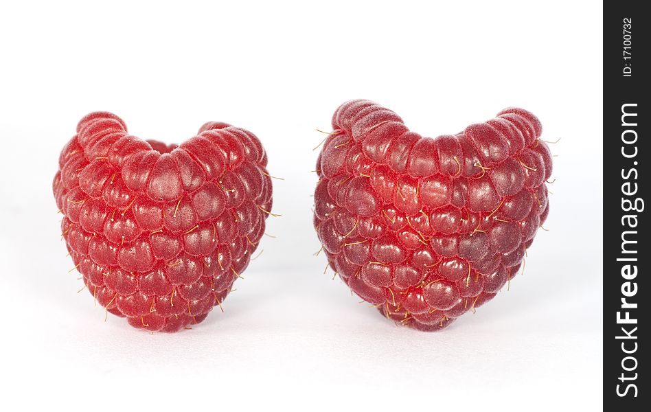 Two raspberries look like two hearts. Two raspberries look like two hearts.