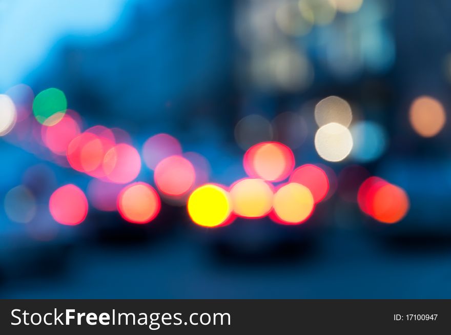 Vehicle traffic at night. The image is defocused. Vehicle traffic at night. The image is defocused