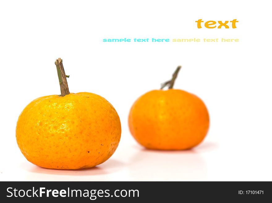 Oranges on white background with copy-space.