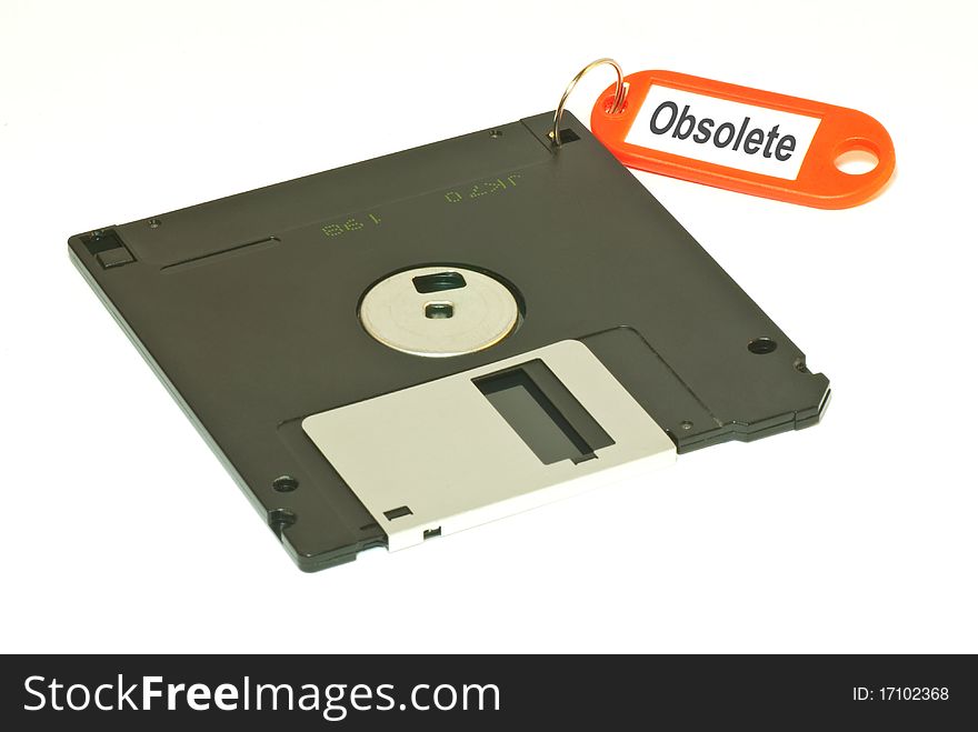 A creative shot that shows a floopy disk with obsolete tag in isolated white background. Clipping path included. A creative shot that shows a floopy disk with obsolete tag in isolated white background. Clipping path included