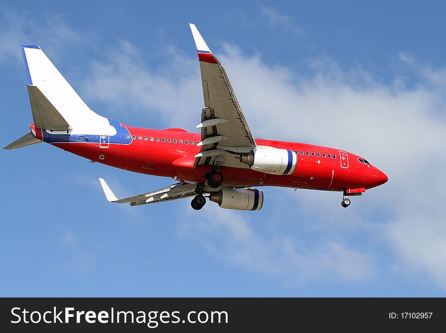 Blue, red and white passenger jet. Blue, red and white passenger jet.