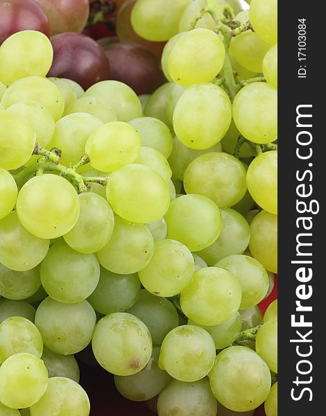 Closeup of a large cluster of green grapes.