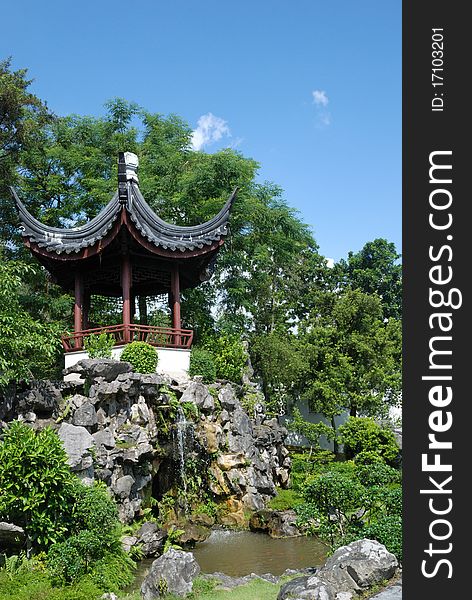 Pavilion with waterfall in Chinese Garden, Singapore