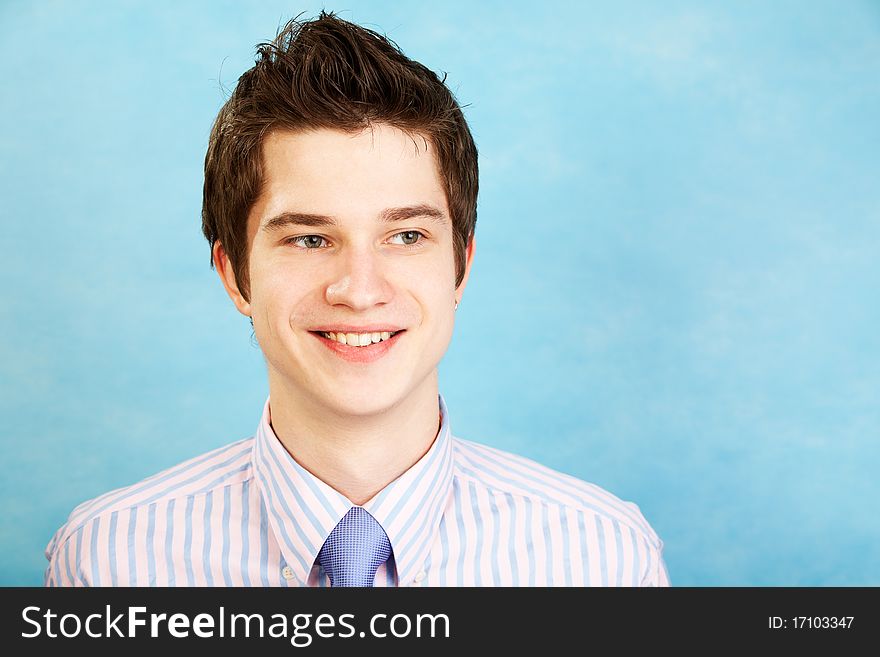 Young smiling caucasian man over blue background. Young smiling caucasian man over blue background