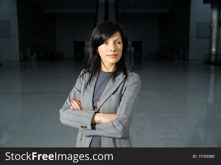 Young beautiful business woman in the business center. Young beautiful business woman in the business center