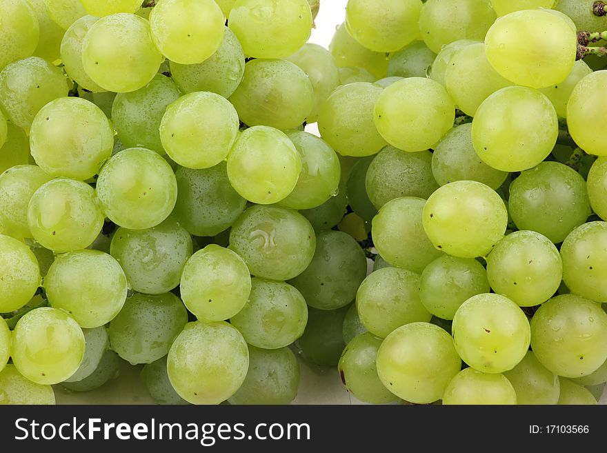 Closeup of a large cluster of green grapes.