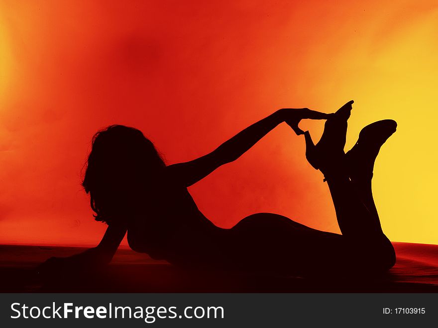 Sexy girl silhouette on a red background