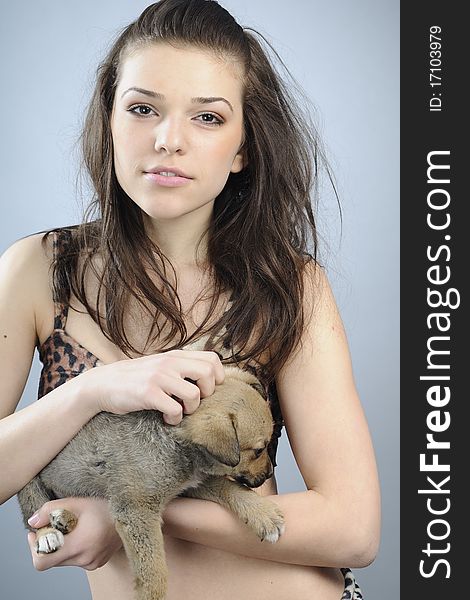 Beautiful prehistoric woman posing with baby animal. Beautiful prehistoric woman posing with baby animal