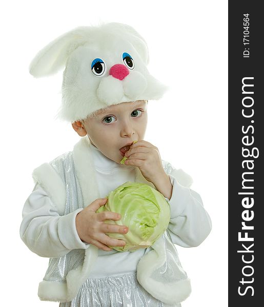 The boy in a suit of a rabbit holds cabbage