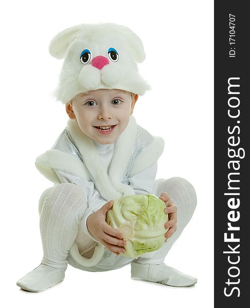 The boy in a suit of a rabbit holds cabbage