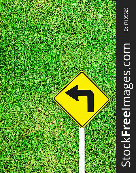 Turn right traffic sign on grass field background texture